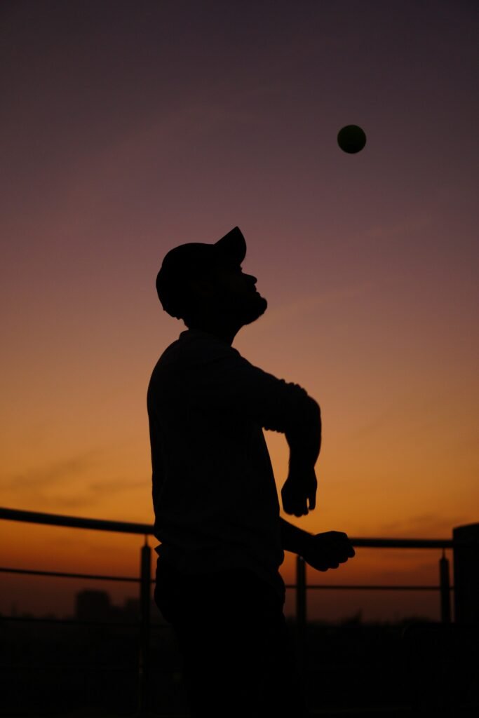 A young boy Playing cricket and ball